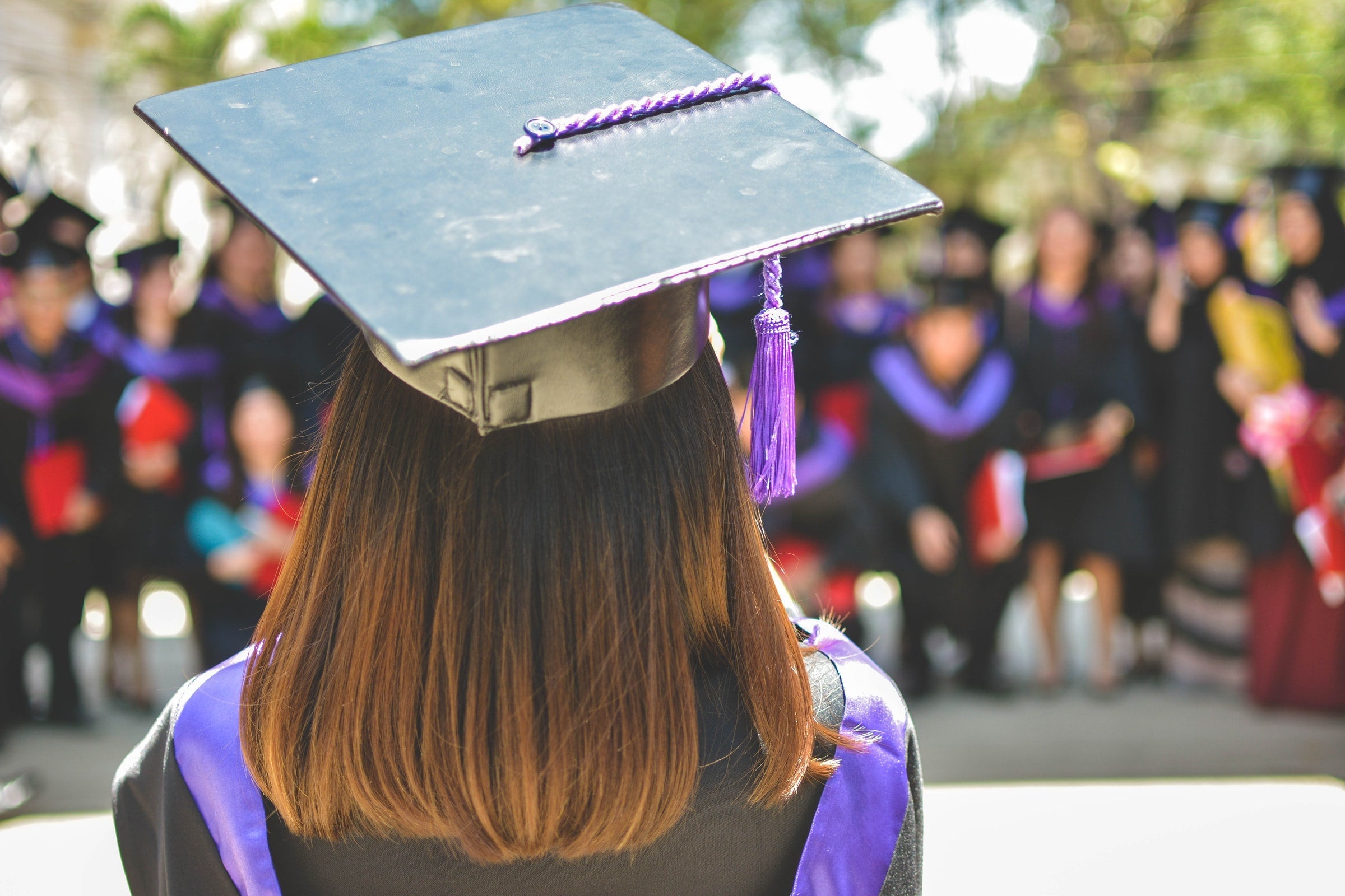 student with graduation hat